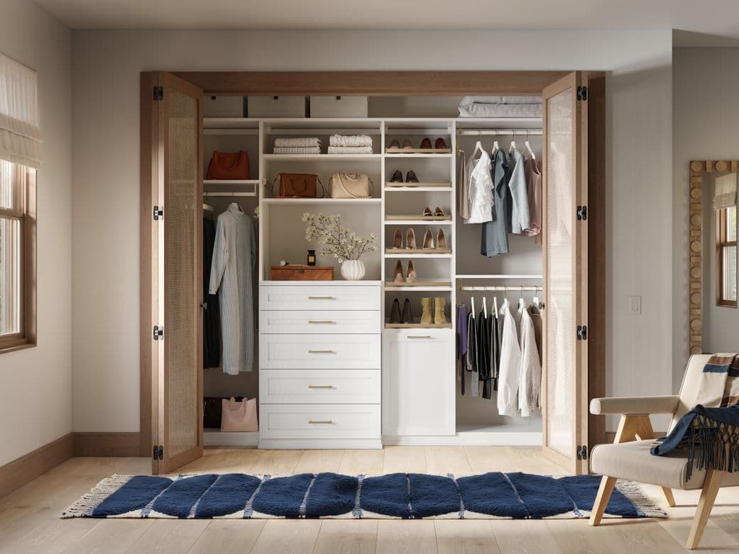 Reach in closet customed with floor to ceiling custom storage by California Closets