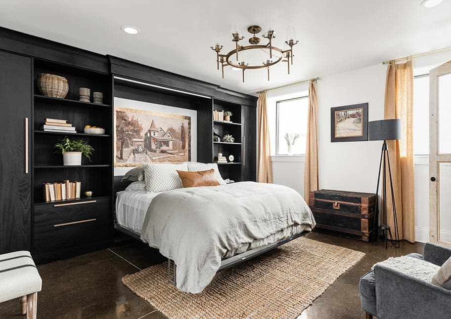 Wall bed in a black finish with custom shelves designed by California Closets