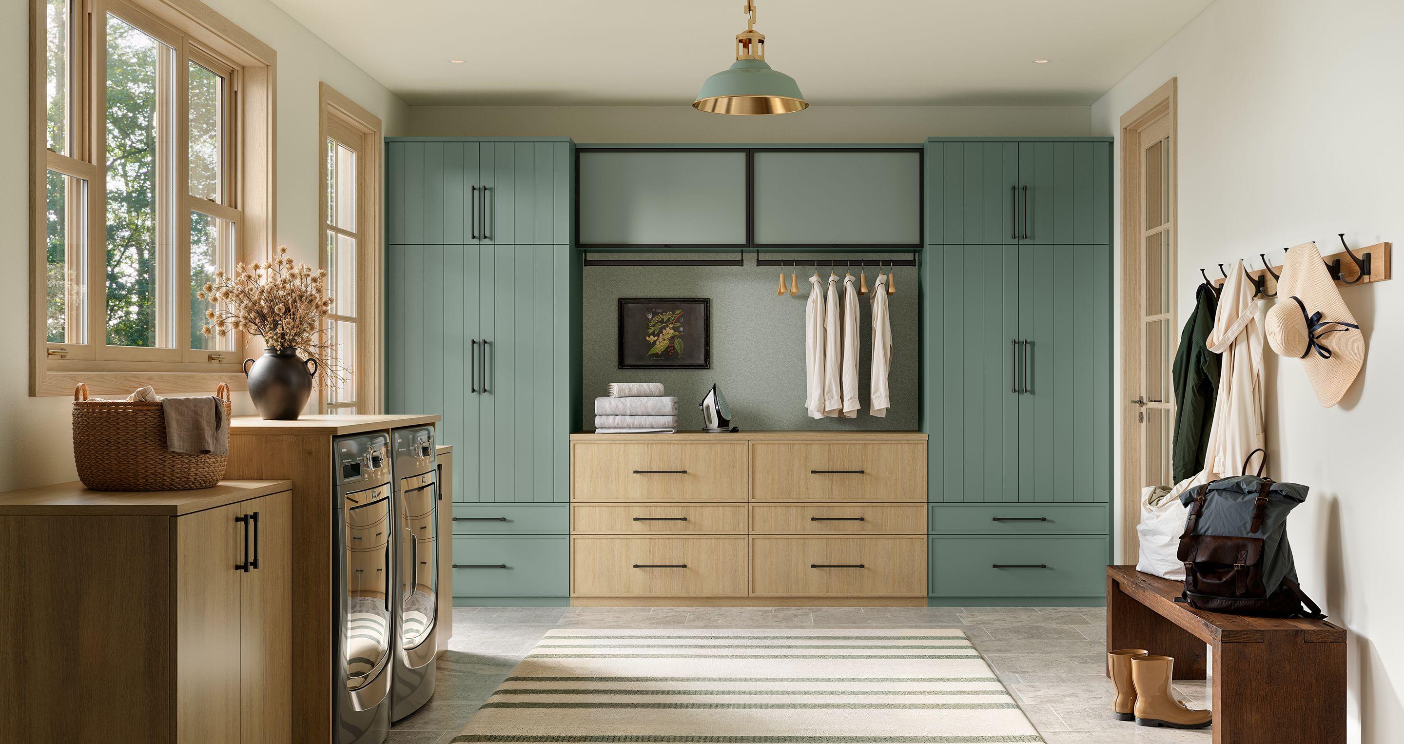 Walk in entryway storage cabinets, drawers and counterspace in Desert Agave green finish from California Closets