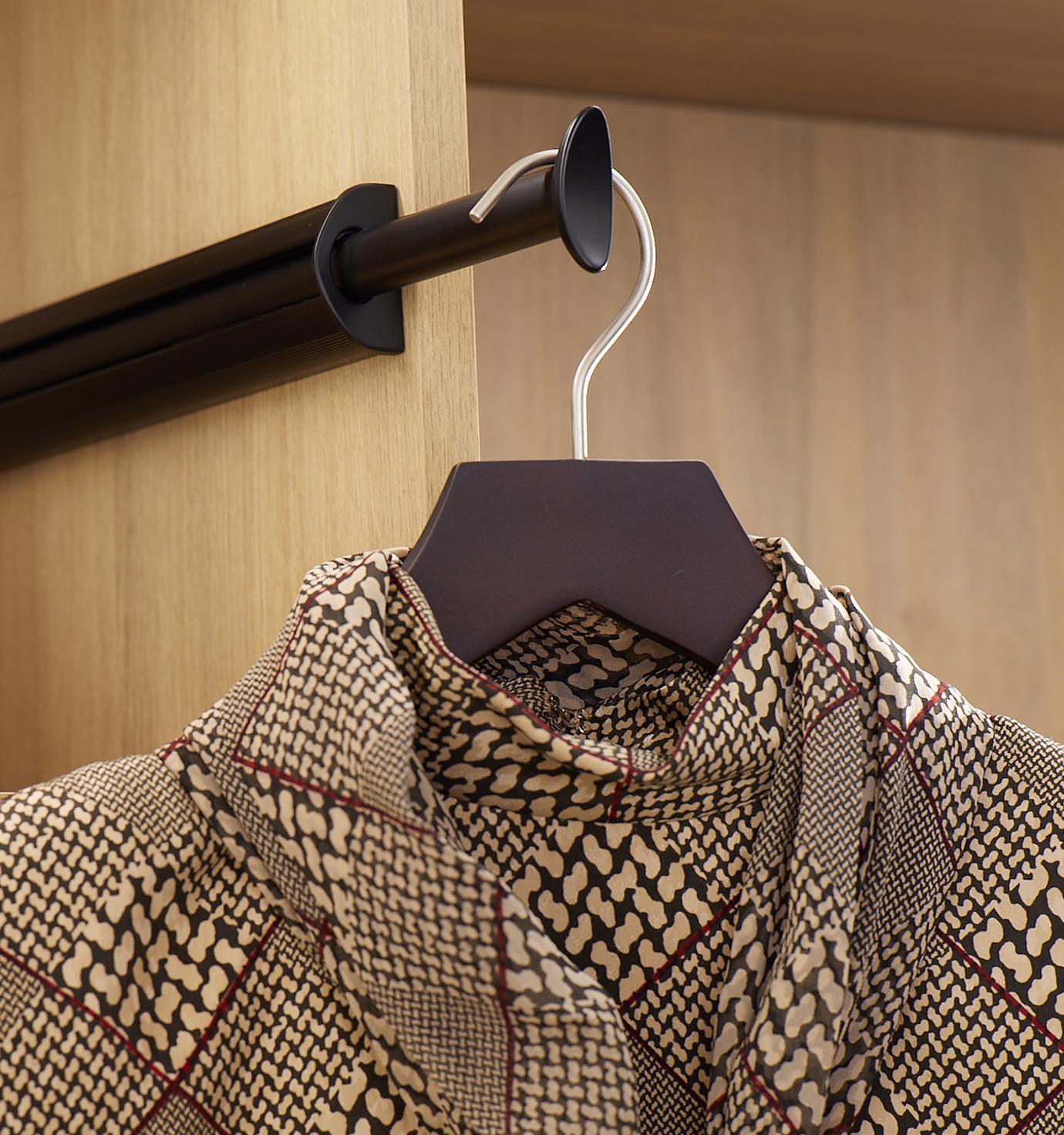 Customized shoe shelf with garment rod and LED lighting from California Closets