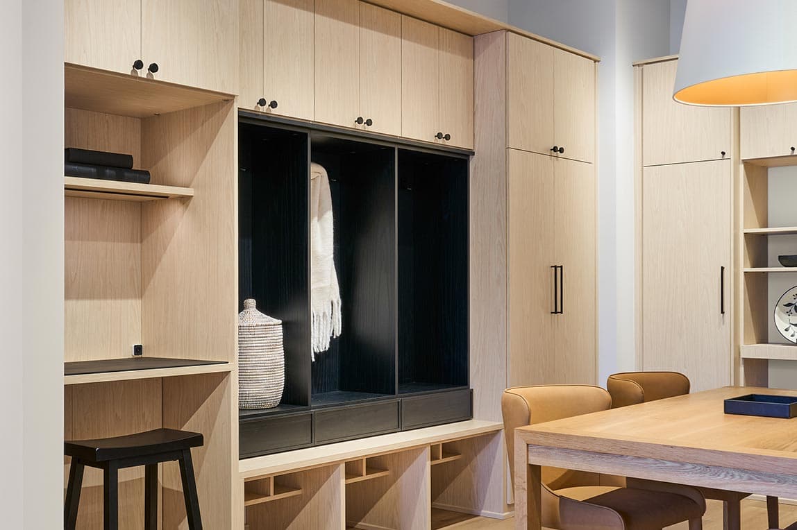 Custom kitchen pantry mudroom storage design in a light wood finish by Califoria Closets