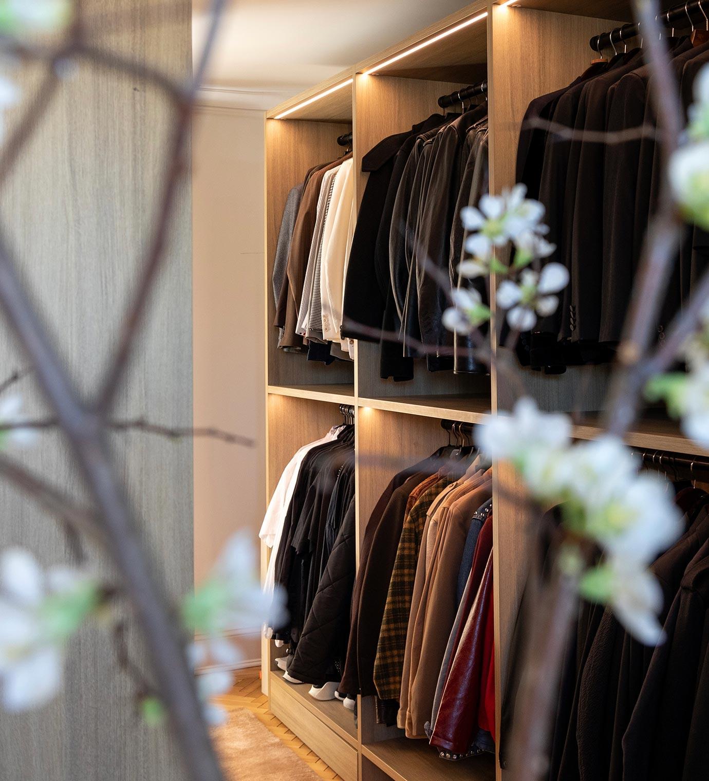 Custom home storage for clothing in walk-in style by California Closets