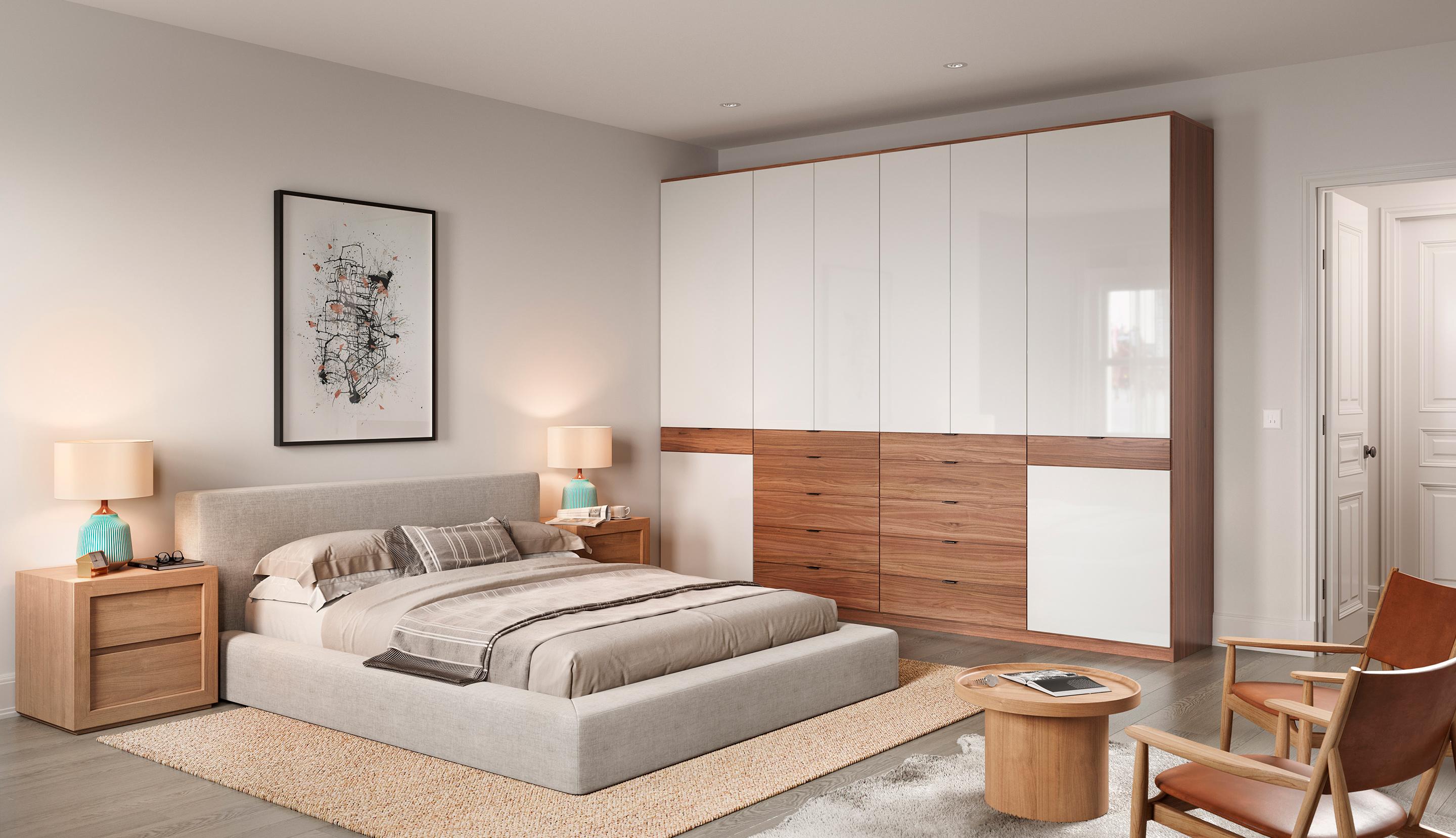 Bedroom wardrobe closet installed with custom cabinet storage, led lighting, and light finishes by California Closets