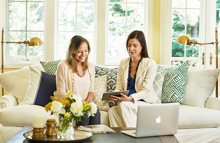 Home design consultation with designer reviewing samples from  California Closets 