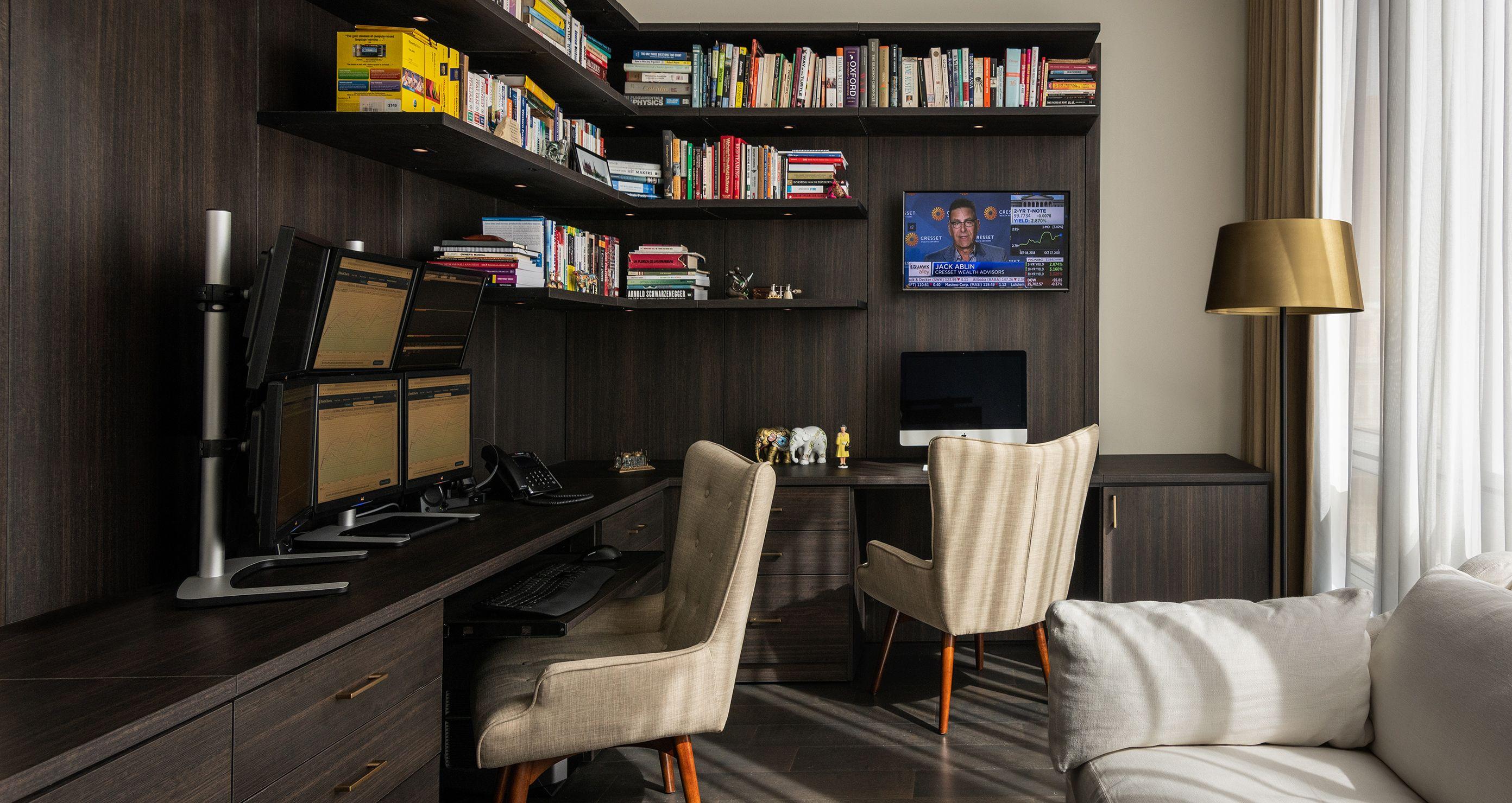 Dark wood finish home office design with custom bookcases designed by California Closets