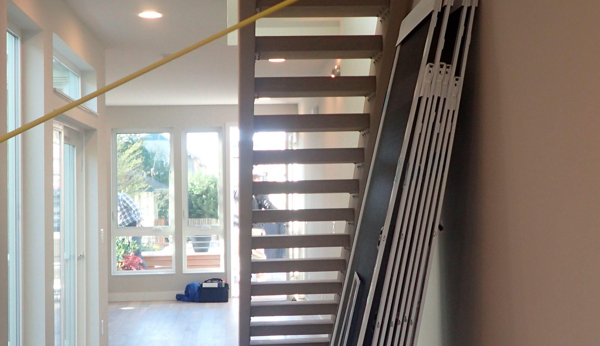 Preparing under-stair area for pantry build by California Closets