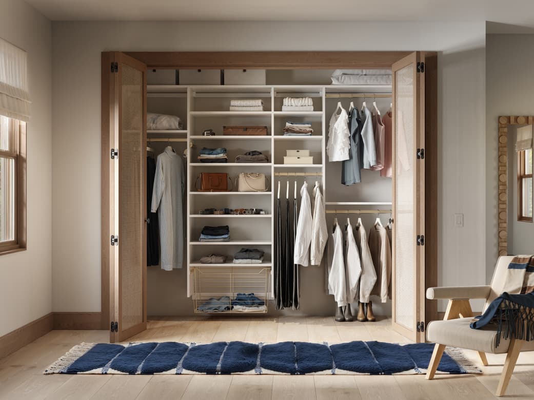 Closet with open shelves and storage cubbies designed by California Closets
