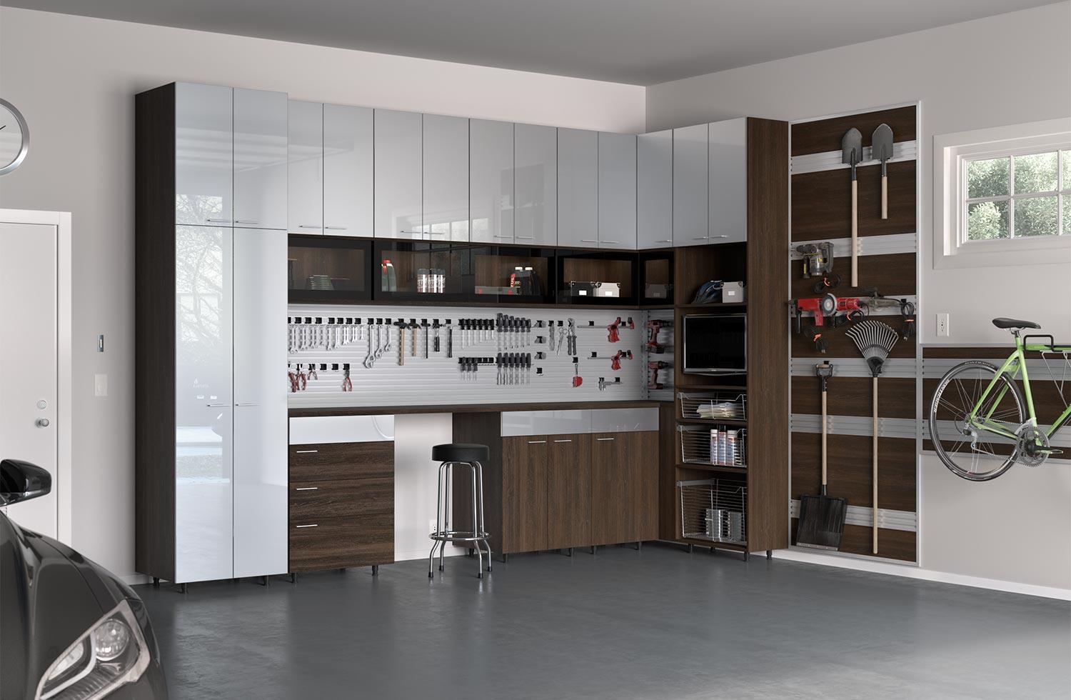 Customized garage with storage workbench and wall tracking designed by California Closets