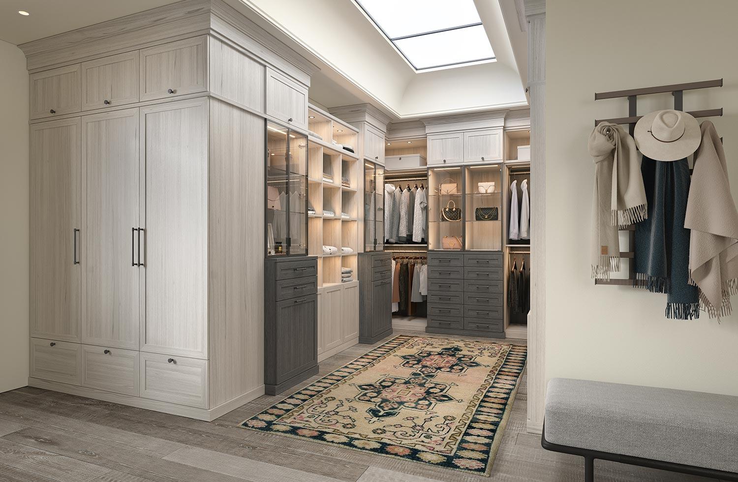 Walk in closet in u-shape layout with custom floor to ceiling storage by California Closets